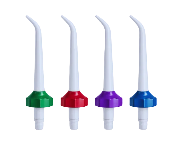 Four white nozzles with colored bases on a light blue background