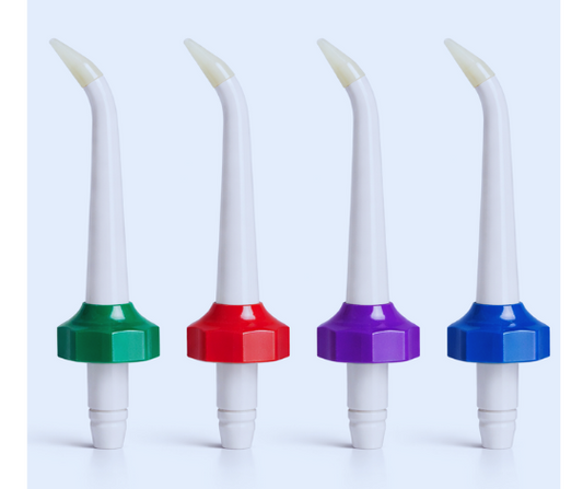 Four dental flossers with colorful ends on a light blue background